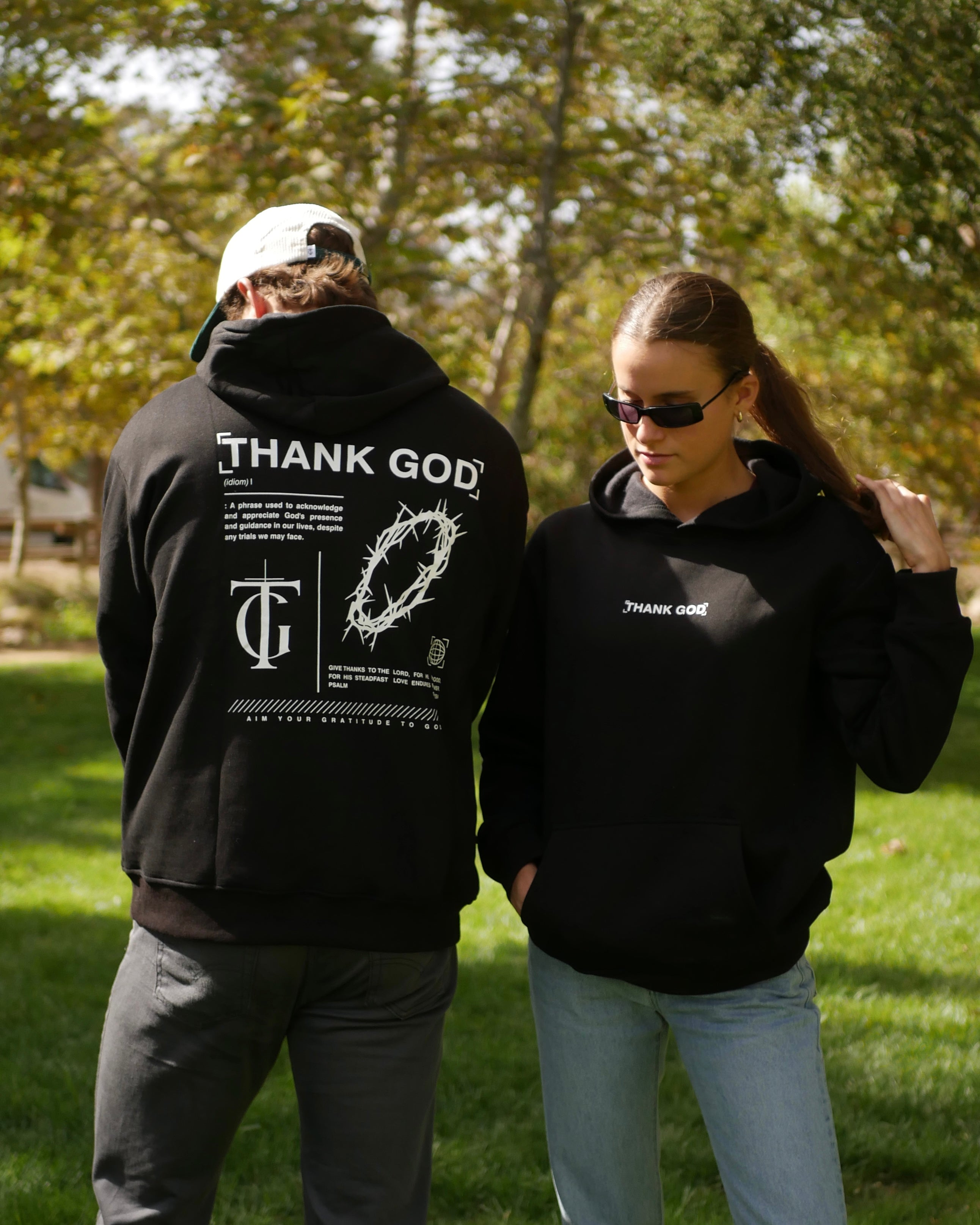Faith-based Christian hoodie by Thank God with unique REDEFINE HOODIE design two person shot front and back