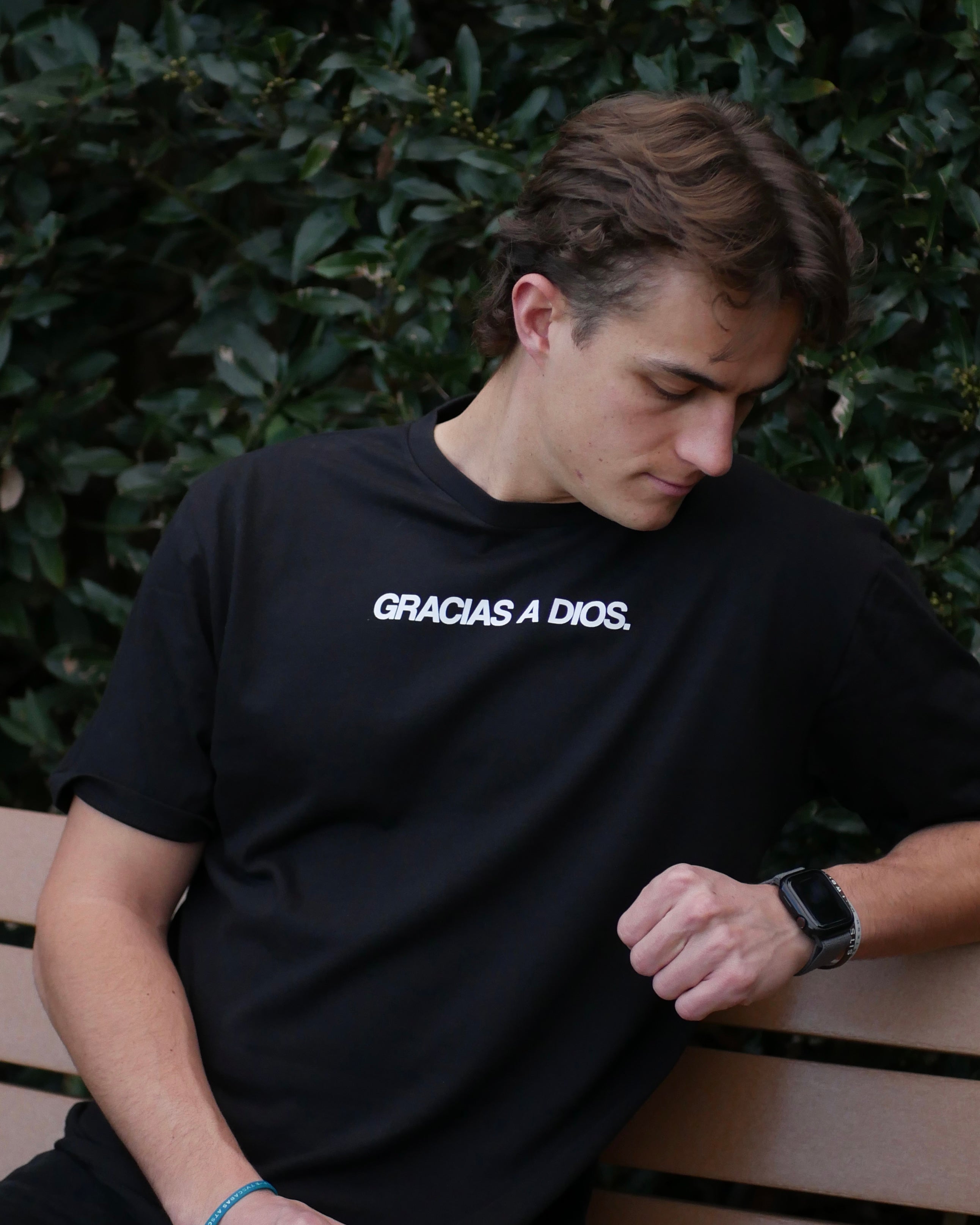 black closer shot lean back GRACIAS_A_DIOS_TEE_Christian_streetwear_t-shirt_by_Thank_God_featuring_GRACIAS_A_DIOS_TEE_style