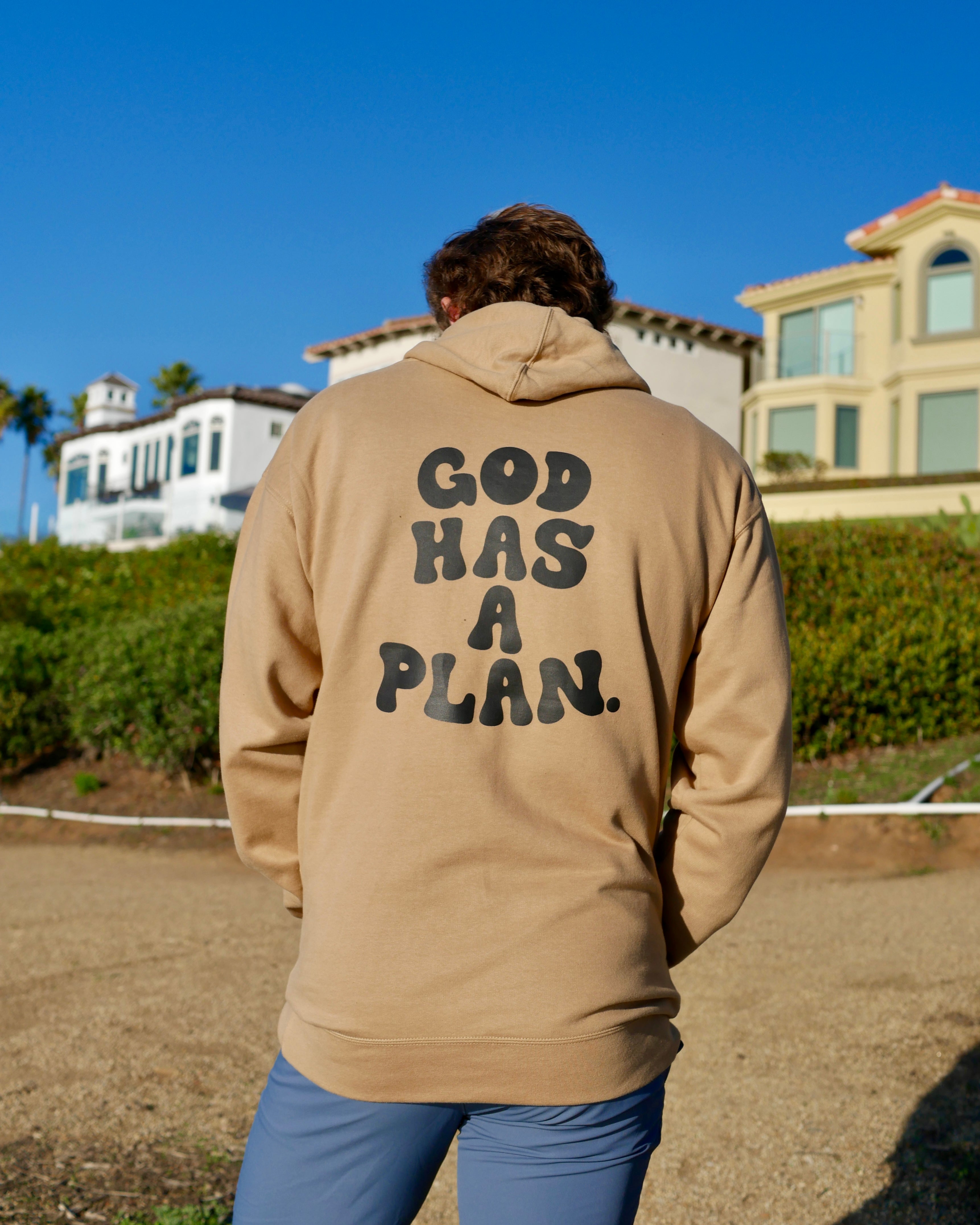 beige hoodie mid range shot GOD HAS A PLAN PREMIUM STRINGLESS HOODIE Faith-based Christian hoodie by Thank God with unique GOD HAS A PLAN PREMIUM STRINGLESS HOODIE design