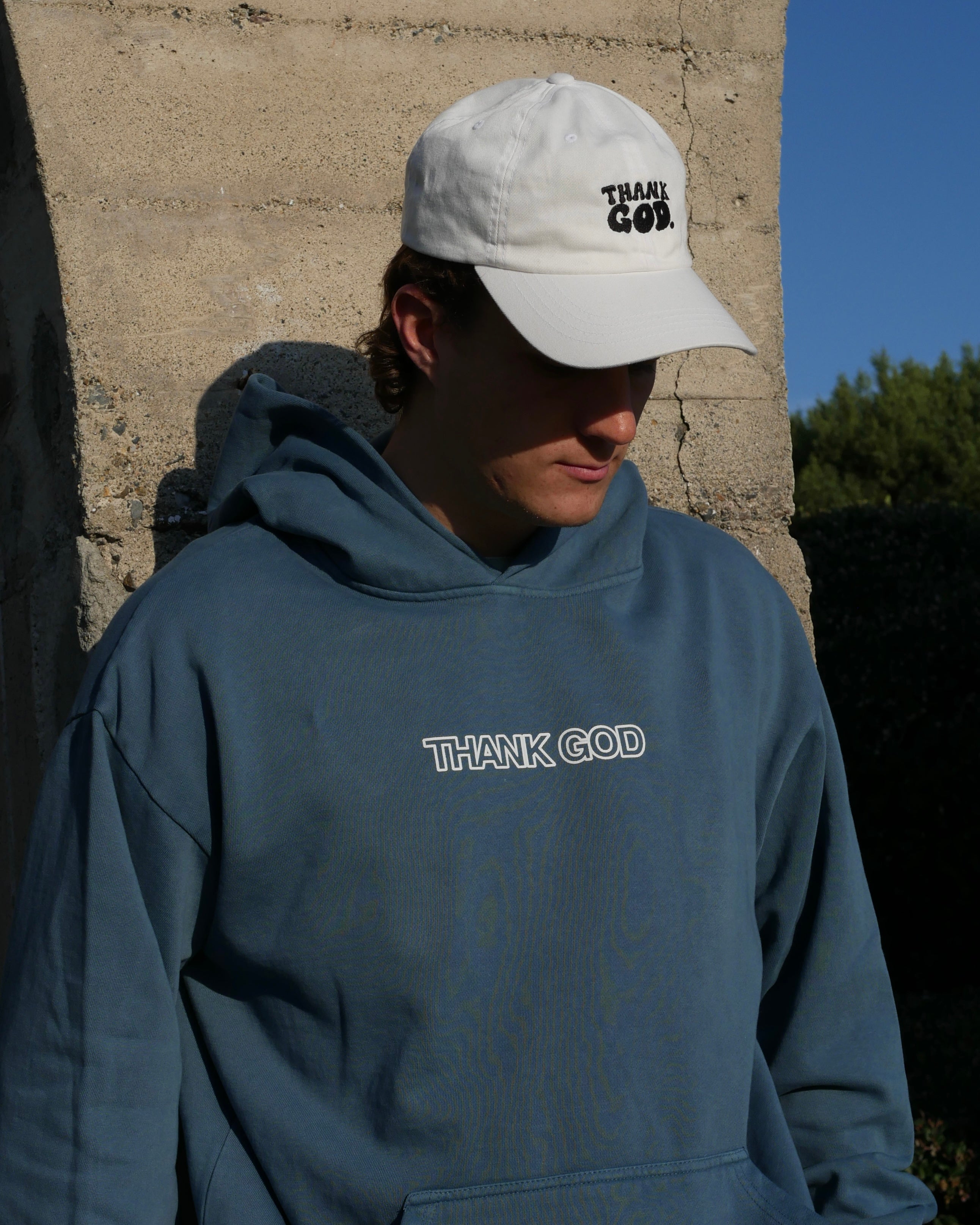 blue front close up shot IN GOD'S HANDS HOODIE Faith-based Christian hoodie by Thank God with unique IN GOD'S HANDS HOODIE design
